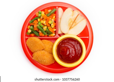 Children's Plate with a Well Balanced Meal of Chicken Nuggets, Vegetables and Sliced Apple