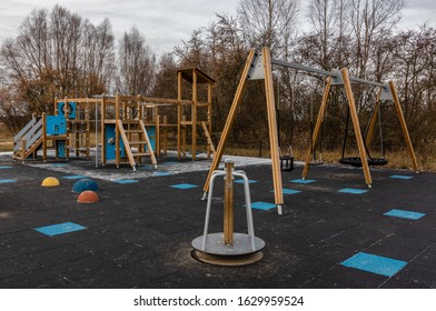 Children's playground with artificial cover, slide and swing. Leisure time, Healthy, active lifestyle - Shutterstock ID 1629959524
