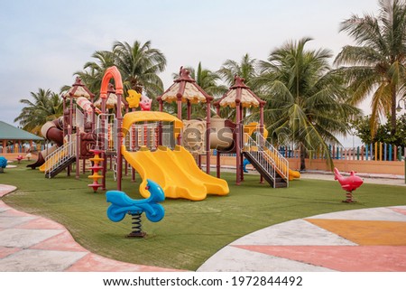children's playground with colorful slides and outdoor swings. the concept of active recreation on a walk.