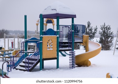 Children's Playground Covered With Snow In Winter