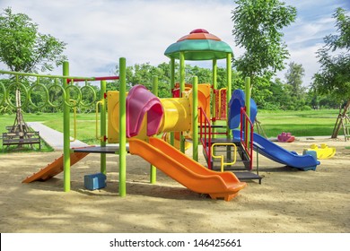 A Children's Playground, A Slider Located On The Sand.