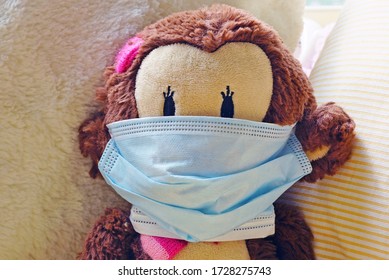 A Childrens Plush Stuffed Animal Toy Wearing A Face Mask During The COVID-19 Pandemic