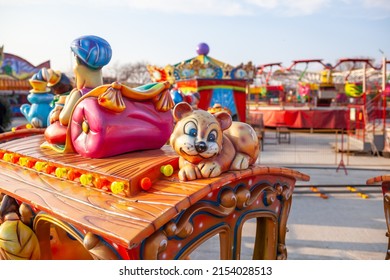 Children's rides and carousels are closed and empty. Joy and entertainment for children. Bright carousels and carriages for transporting children are empty. Carousels are waiting for children.