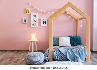 Children's room interior with comfortable bed