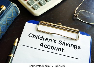 Children's Savings Account Form In A Clipboard.