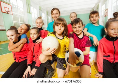 Children's Soccer Team Having Fun Together In Gym