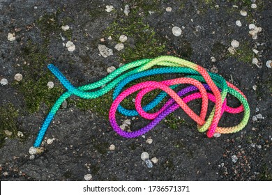 Children's Sports Tape Elastic Band For Physical Education Is On The Ground. Multi-colored Texture.