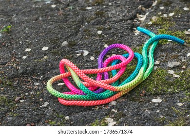 Children's Sports Tape Elastic Band For Physical Education Is On The Ground. Multi-colored Texture.