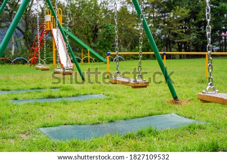 Children's swings in the lawn park