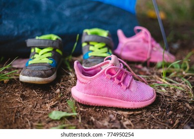 Children's Tennis Shoes In The Dirt