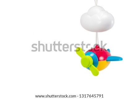 children's toy hanging airplane multicolored with a cloud isolated on a white background