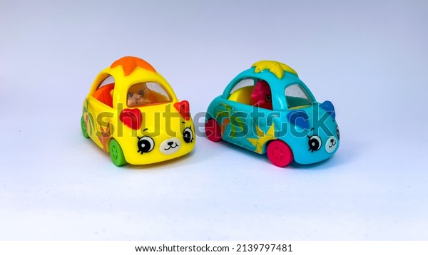 children\'s toy mobile car in blue and yellow.\
which is usually played in the\
afternoon.