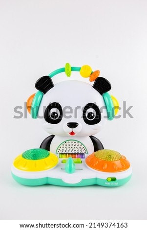 a children's toy plastic panda on a white background