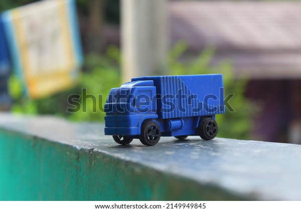 children's
toys: blue toy cars, side view of the
car