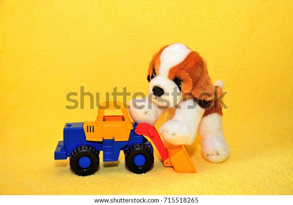 Children\'s\
toys, a dog and a car on a yellow\
background