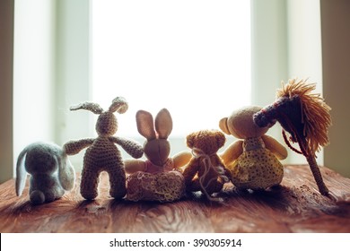 children's toys on wooden floor in front of the window - Powered by Shutterstock