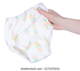Children's training panties in hand on a white background isolation