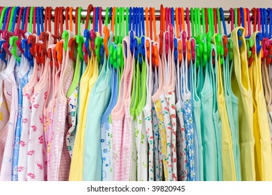 childrens undershirts on clothes hangers at a store