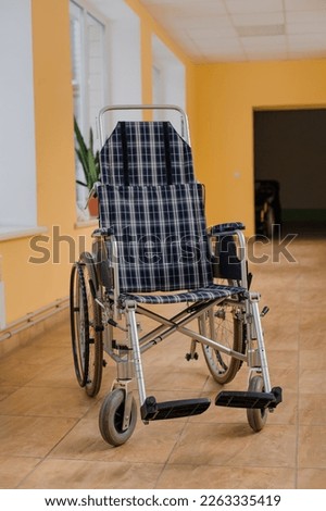 Similar – Senior woman in a wheelchair alone