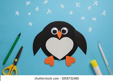 Children's Winter Craft Penguin Made Of Paper. Children's Art Project. DIY Concept. Easy Craft For Kids