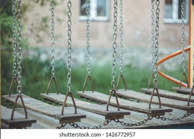 Children's Wobbly Suspension Rope Bridge Close-up On The Playground On A Blurred Background. Copy Space. Leisure.