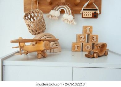 Children's wooden airplane, wooden blocks, wooden car. Children's toys for games. Educational toys, wooden play set. - Powered by Shutterstock