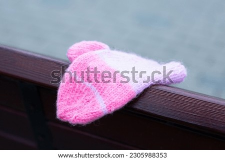 А children's woolen mitten forgotten on the street Сток-фото © 