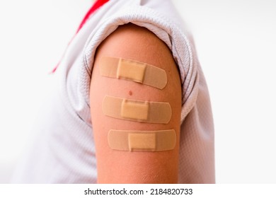 Child's Arm With Bandaid  To Calm His Pain, Isolated On White.