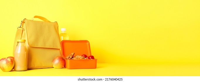 Child's Bag And Lunchbox With Tasty Food On Yellow Background With Space For Text