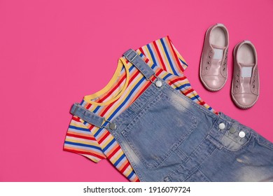 Child's Clothes And Shoes On Pink Background, Flat Lay