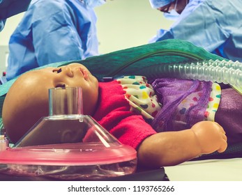 A Child's Doll Lying At The Foot Of The Operating Table As The Child Undergoes Surgery. 