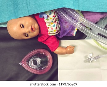 A Child's Doll Lying At The Foot Of The Operating Table As The Child Undergoes Surgery. 