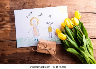 Childs drawing of her mother, yellow tulips, little gift