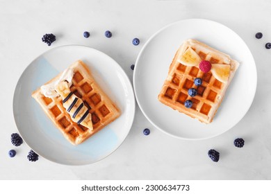 Child's Fathers Day shirt waffles with necktie and bowtie with buttons. Fathers Day breakfast concept. Above view on a white marble background. - Powered by Shutterstock