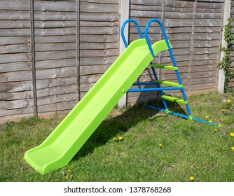 Childs Green Slide In A Typical UK British Garden On A Sunny Day