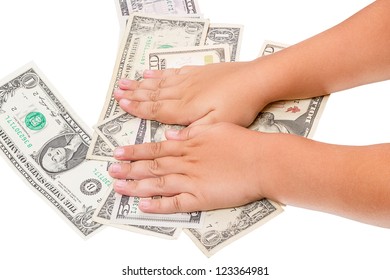Child's hand and cash U.S. dollars isolated on a white background