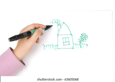 Child's hand drawing house
