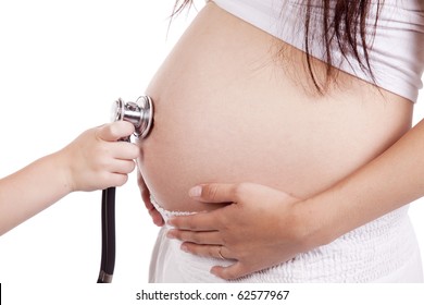 A Childs Hand Is Holding A Stethascope On The Belly Of A Pregnant Woman.