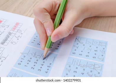 Child's Hand With Incorrect Holding Of Pencil, Homewortk, Math