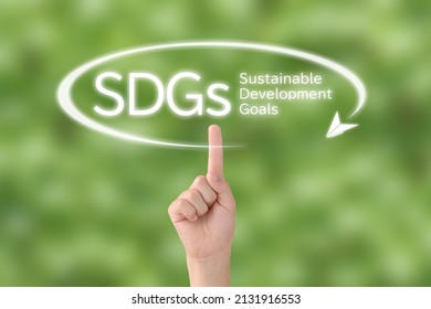 Child's hand with pointing gesture with SDGs word and paper airplane pictogram