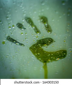 Child's Hand Print On A Steamy Window