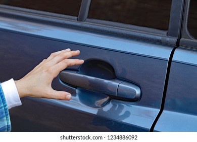 Child's Hand Reaching For Vehicle Car Door Handle