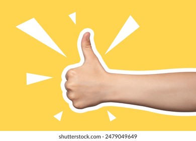 Child's hand shows thumbs up, class, like. Gesture isolated on yellow background. Modern design, positive. Art collage in magazine style - Powered by Shutterstock