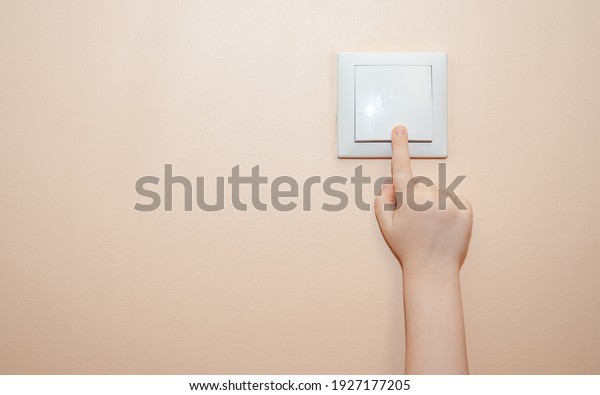 the child\'s hand turns\
off the light .