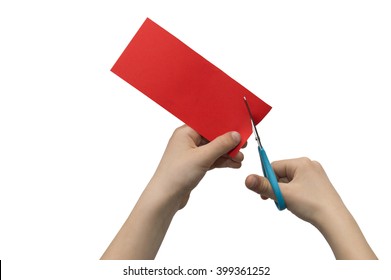 Child's hands cutting colored red paper with scissors isolated on white background - Powered by Shutterstock