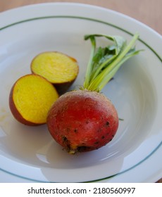 Child's Hands Holding Yellow Beets