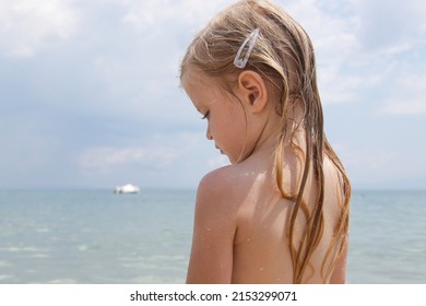 Child's Long Hair On The Beach. Wet Hair Close Up Image. Hair Damage Due To Salty Ocean Water And Sun, Summertime Hair Care Concept.	