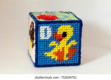 Child's Needlepoint Alphabet Block. Letter D With Duck Image. White Background.