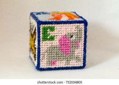 Child's Needlepoint Alphabet Block. Letter E With Elephant Image. White Background.