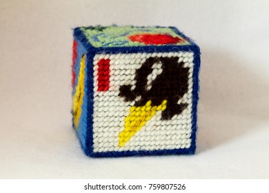 Child's Needlepoint Alphabet Block With Letter I And Image Of An Ice Cream Cone. White Background.